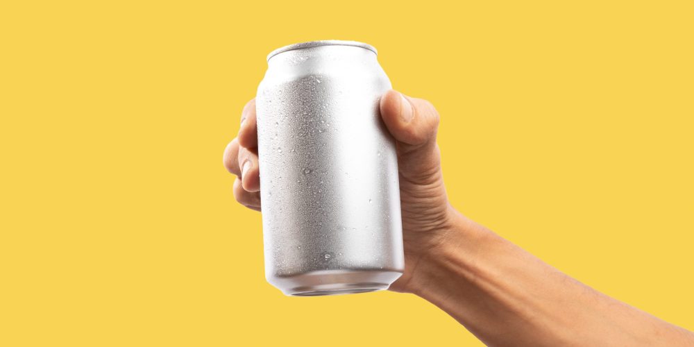 Man,Holding,Aluminum,Can,On,Yellow,Background